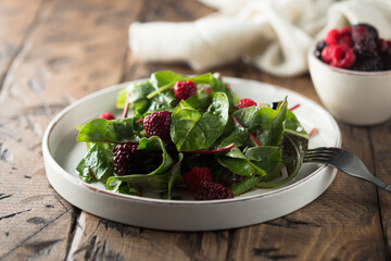 Healthy green salad with raspberry