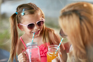 adorable  little girl having fun with her mom