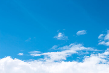 Naklejka na ściany i meble Clould on vast bright blue sky background and space 