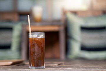 ice americano coffee on wooden table 