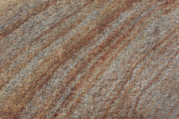 Natural stone texture. Beige rock with brown stripes. Beige rock background with space for text.