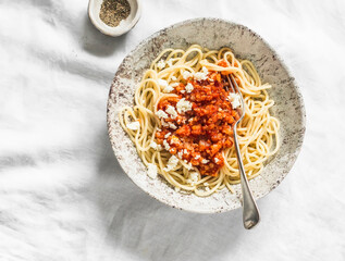 Delicious vegetarian cauliflower cabbage bolognese sauce with spaghetti on light background, top...