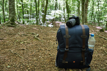 photo backpack in the mountains, photo backpack in the middle of the forest for hiking