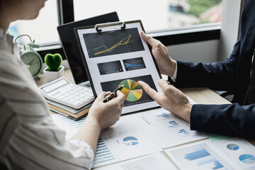 The head of the finance department presents the financial information to the executives, the...