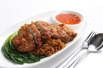 chef cook dry noodle mee with grilled chicken chop, pork cutlet and vegetable in soy sauce and chilli sauce asian halal menu