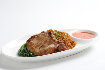 chef cook dry noodle mee with grilled chicken chop, pork cutlet and vegetable in soy sauce and chilli sauce asian halal menu