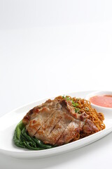 chef cook dry noodle mee with grilled chicken chop, pork cutlet and vegetable in soy sauce and chilli sauce asian halal menu