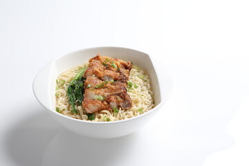 chef cook noodle mee soup with grilled chicken chop, pork cutlet and vegetable asian halal menu