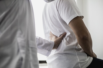 Professional physiotherapists are working to relax the muscles for patients who are treated for muscle disorders, most patients are office workers who sit for a long time causing pain. office syndrome