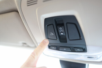 Man finger pressing sos emergency button to contact call center