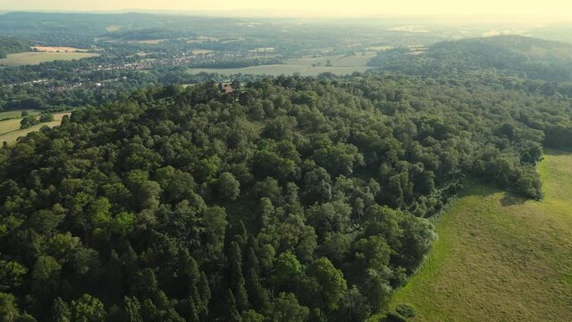 Aerial footage of the British country side fields in the winter time, Surrey country side, surrey hills. Guildford, UK.
