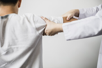 A professional physiotherapist is doing stretching for a patient, the patient has muscle dysfunction due to hard work, most often an office worker who has problems sitting for long periods of time.