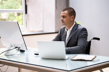 Handicapped Businessman Using Laptop Computer