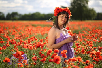 Woman in poppies field