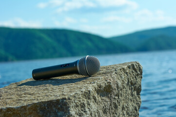 microphone on the stone bank of the river
