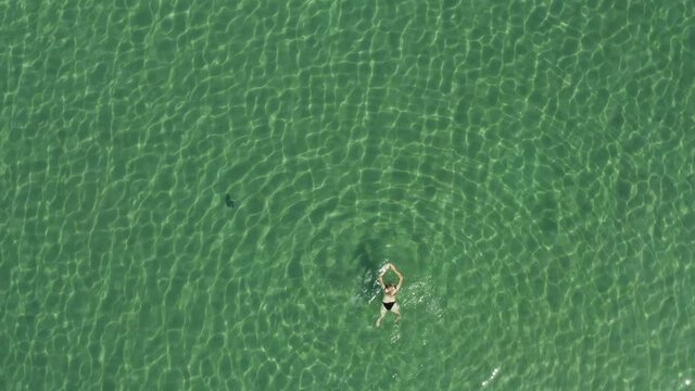 Aerial view of a girl floating in the Adriatic Sea, Croatia