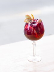 Sangria in a glass with ice and orange slices