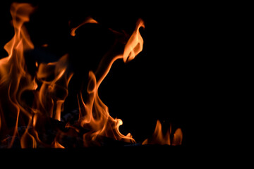The fire. Flames. Banner, abstract background, wallpaper. Flame on a black background.
