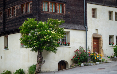 Beautiful facade of a historic farmhouse in Valais, Switzerland