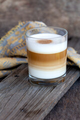 Homemade cappuccino in a glass on the table
