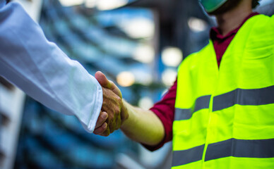 Two businessmen handshaking. Business men wearing protective mask