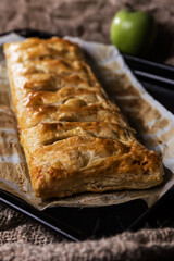 Homemade puff pastry pie filled with apple and cinnamon