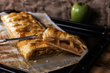 Homemade puff pastry pie filled with apple and cinnamon