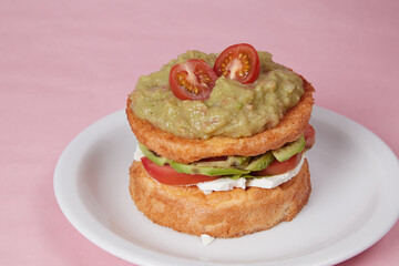 pancakes with meat and guacamole, lettuce leaves and vegetables, hot dish for lunch, pastries with sour cream