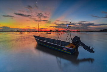 Boat fishing in a beautiful sunset time in one of Batam island fishing village 