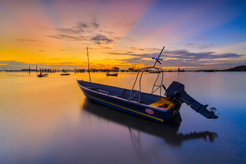 Boat fishing in a beautiful sunset time in one of Batam island fishing village 