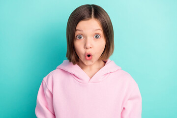 Photo of impressed short hairdo small girl open mouth wear pink sportswear isolated on teal color background