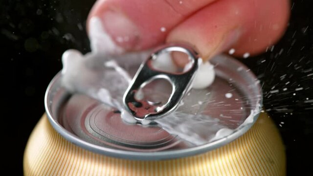 Super slow motiion of opening a can of beer. Filmed on high speed cinematic camera at 1000 fps.