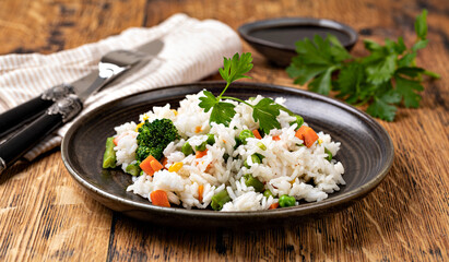 Bowl with tasty rice and vegetables
