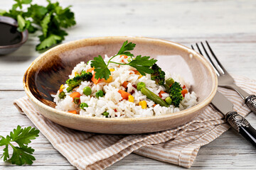 Bowl with tasty rice and vegetables
