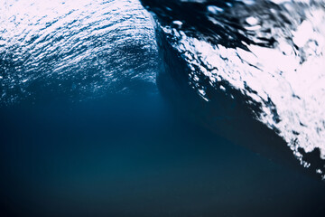 Ocean wave and vortex underwater with crystal water.