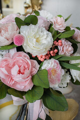 Bridal bouquet of preserved flowers. Bride bouquet in delicate pink and white tones, mix roses.