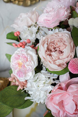 Bridal bouquet of preserved flowers. Bride bouquet in delicate pink and white tones, mix roses.