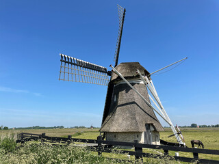 Fototapeta na wymiar A windmill around Grou