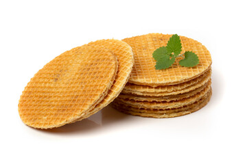 Caramel waffles are round isolated on a white background.