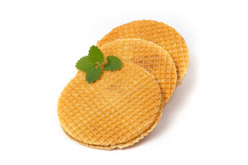 Caramel waffles are round isolated on a white background.