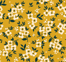 Trendy seamless vector floral pattern. Seamless print made of small white flowers. Summer and spring motifs. Yellow gold background. Stock vector illustration.