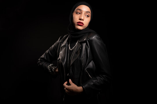 Gorgeous Muslim woman in black headscarf and leather jacket