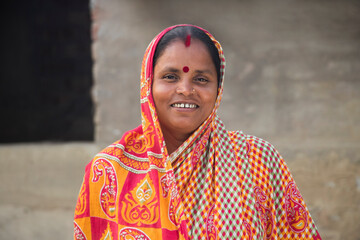 Indian Rural Woman  Smiling and Standing - obrazy, fototapety, plakaty