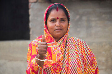 Indian Rural Woman showing thumbs up sign