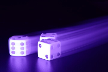 Three dice with motion blur