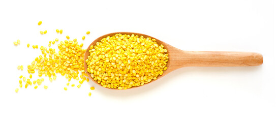 Dry organic split peeled mung bean pile in wooden spoon on white background