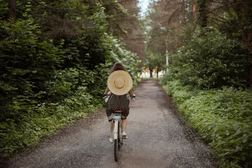 Schilderijen op glas young girl riding a bicycle in the woods © Надя Запара