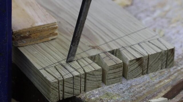 dovetail joint being cut with a chisel