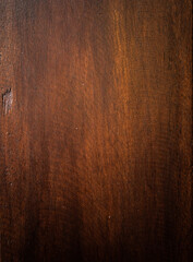 Naklejka premium Ciemno brązowe drewniane tło, tekstura desek z pęknięciami.