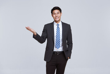 Handsome and friendly face asian businessman smile in formal suit on white background studio shot.